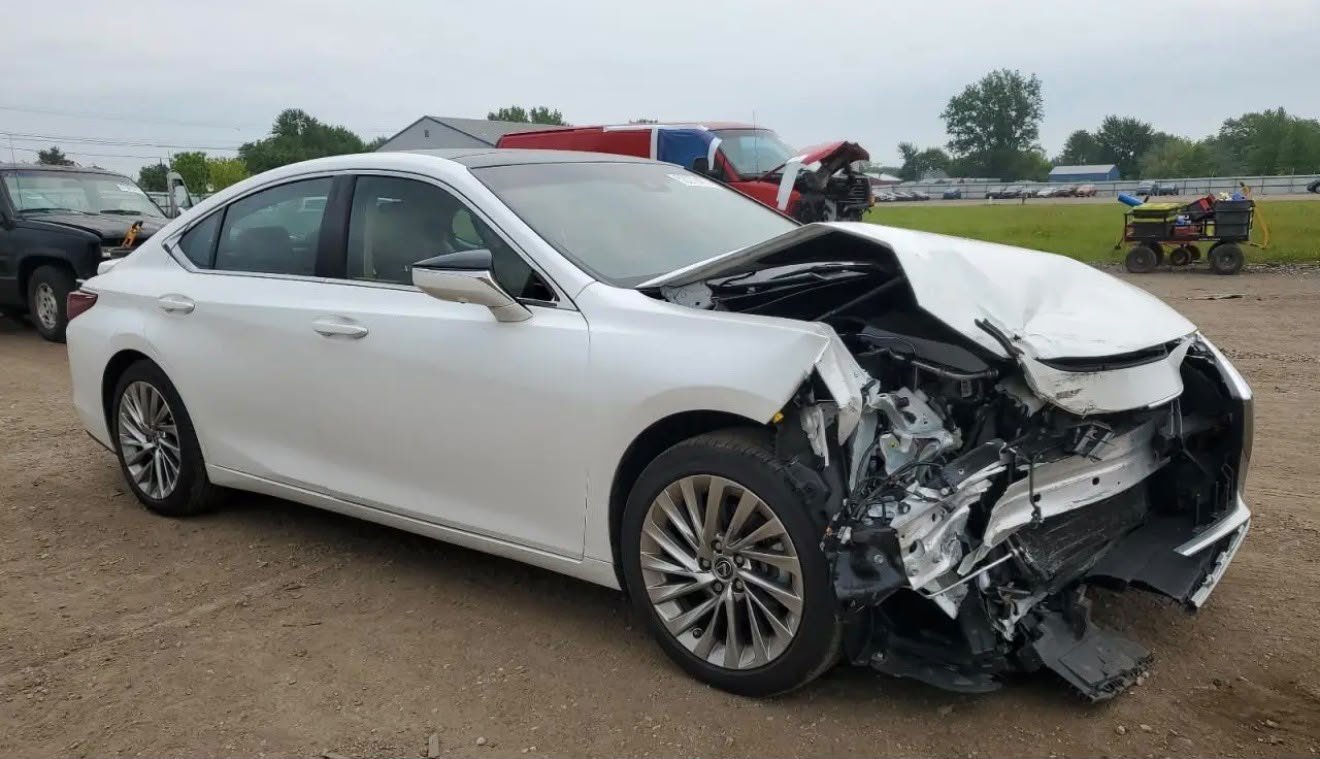 Luxury sedan front passenger collision damage
